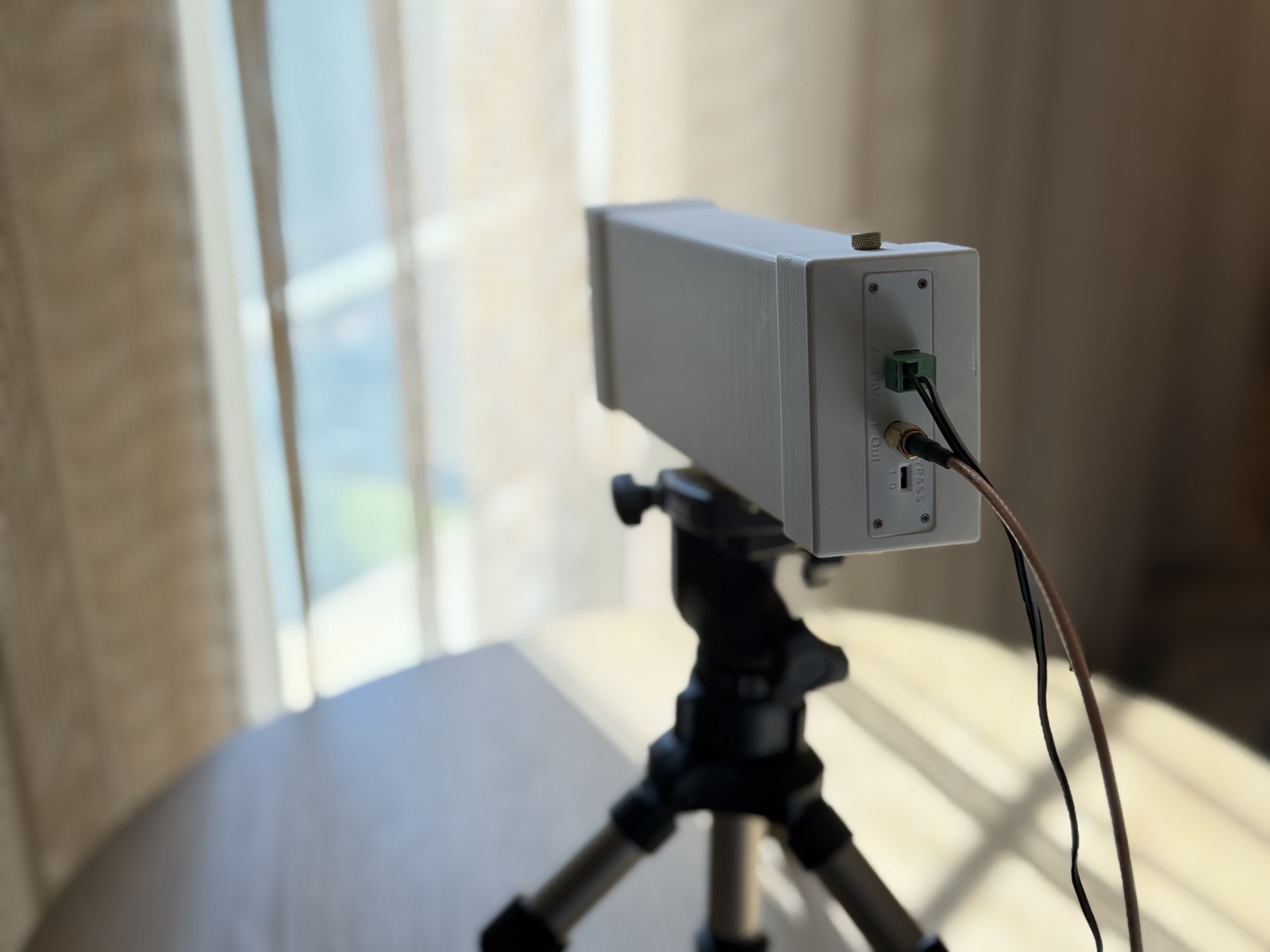 Custom RF enclosure with SMA connectors mounted on tripod